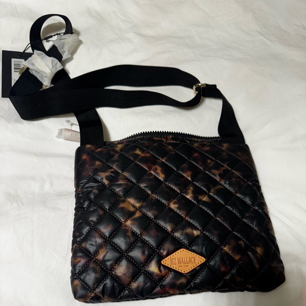 Brand new, with tags, never used.

MZ Wallace metro crossbody in animal print.
